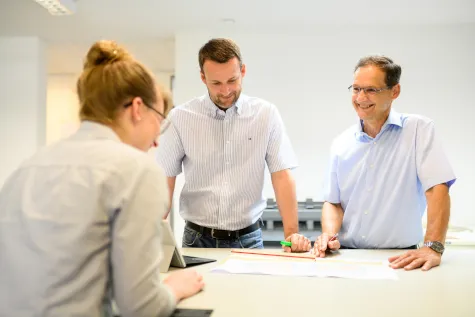 Building drawing and documents on a table during advice on planning law