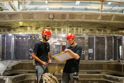 Surveying engineers from our 3D surveying team at work in a shipyard