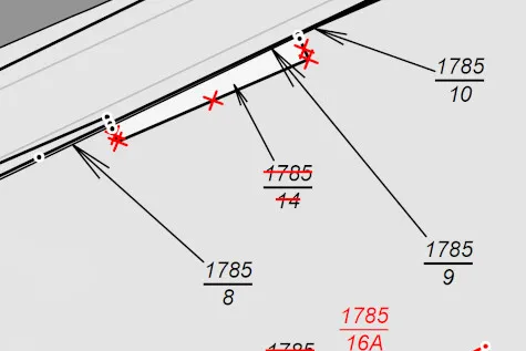 Detail of a survey record: old parcel numbers are crossed out, the new number is written in red